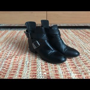 Leather material black ankle booties.